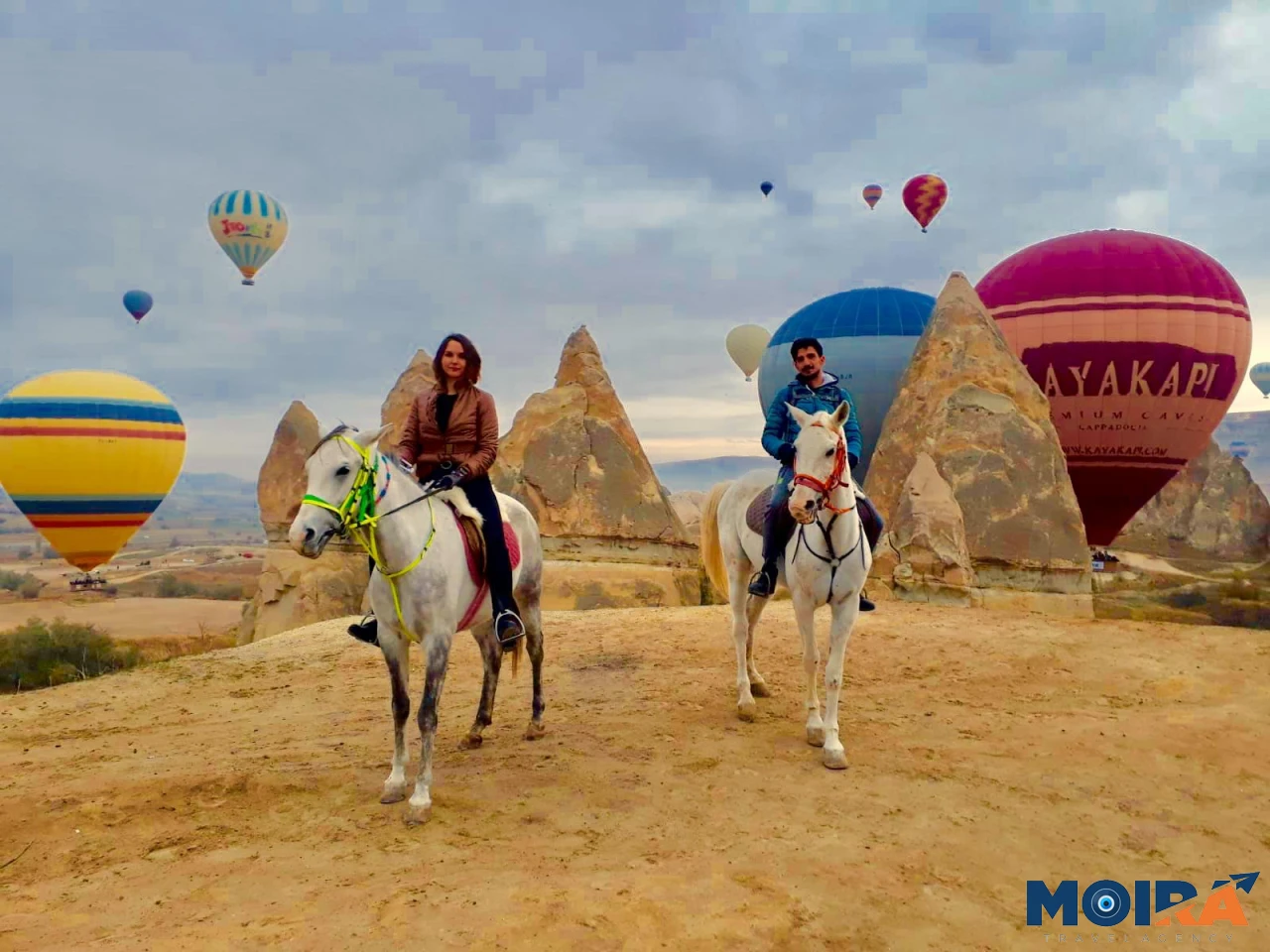 horseback-riding-trail-cappadocia-rock-formations-golden-hour-turkey