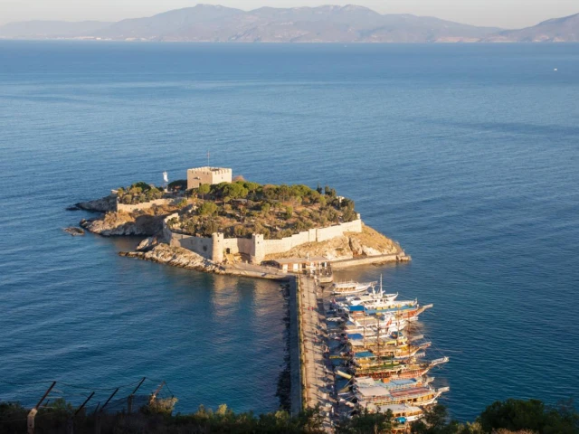 historic-coastal-fortress-island-causeway-scenic-harbor-mountains-turkey