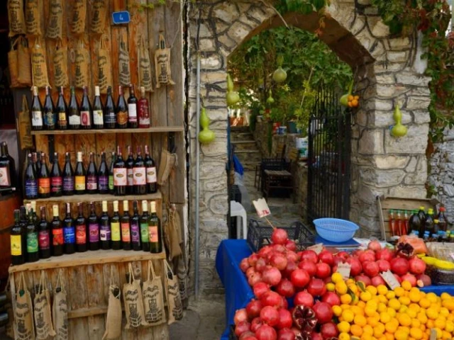 traditional-mediterranean-market-stall-wine-bottles-fresh-fruits-stone-archway-turkey